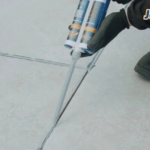 Joint-It Porcelain Epoxy Grout being applied in patio joints with an application gun