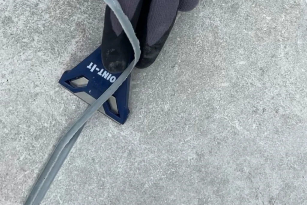 Scraping off porcelain grout